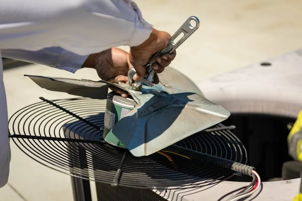 Modern AC replacement unit being installed at Las Vegas home - how to check if your system is registered