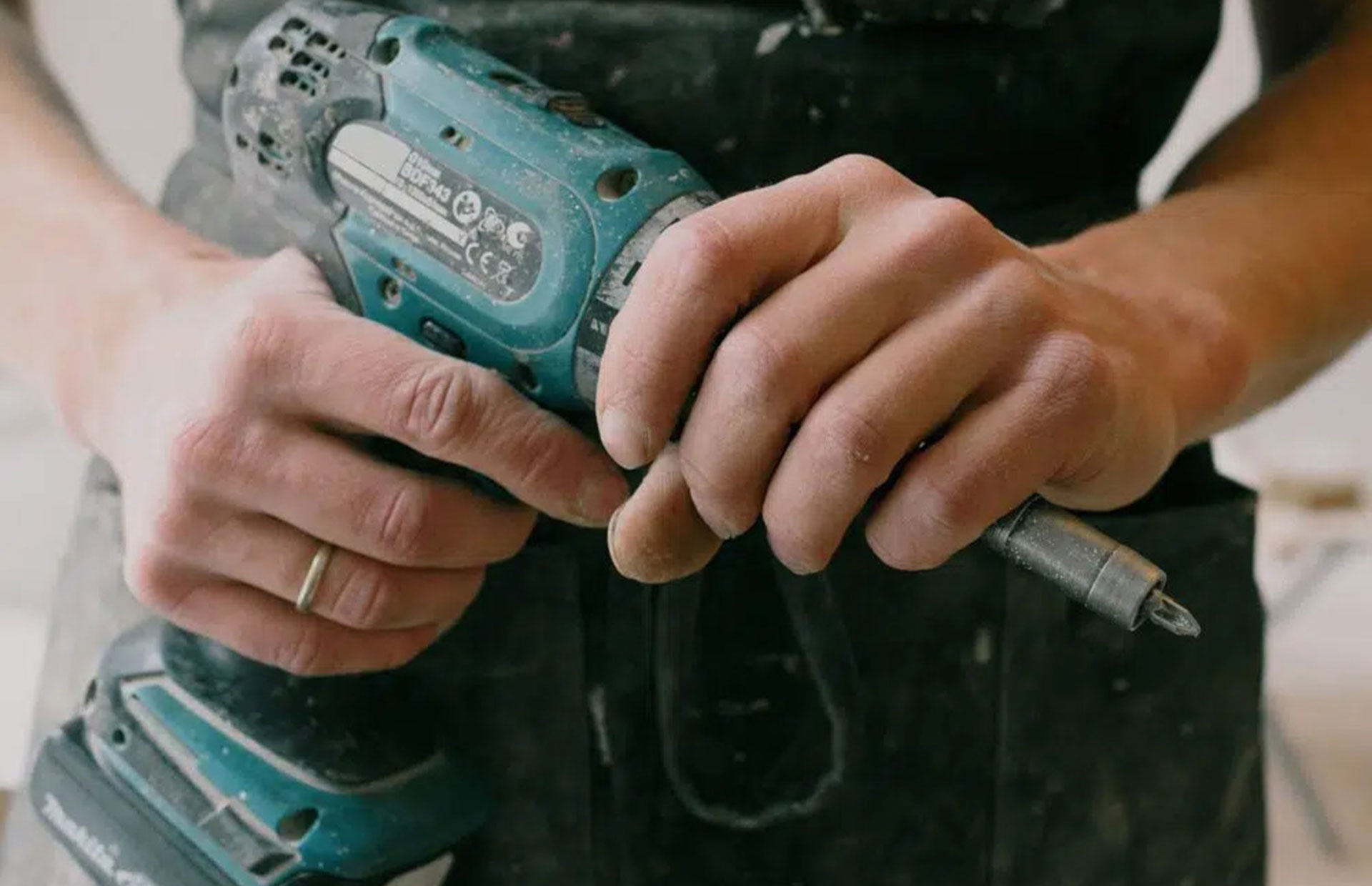 Technician performing air conditioner repair on residential unit - warranty implications